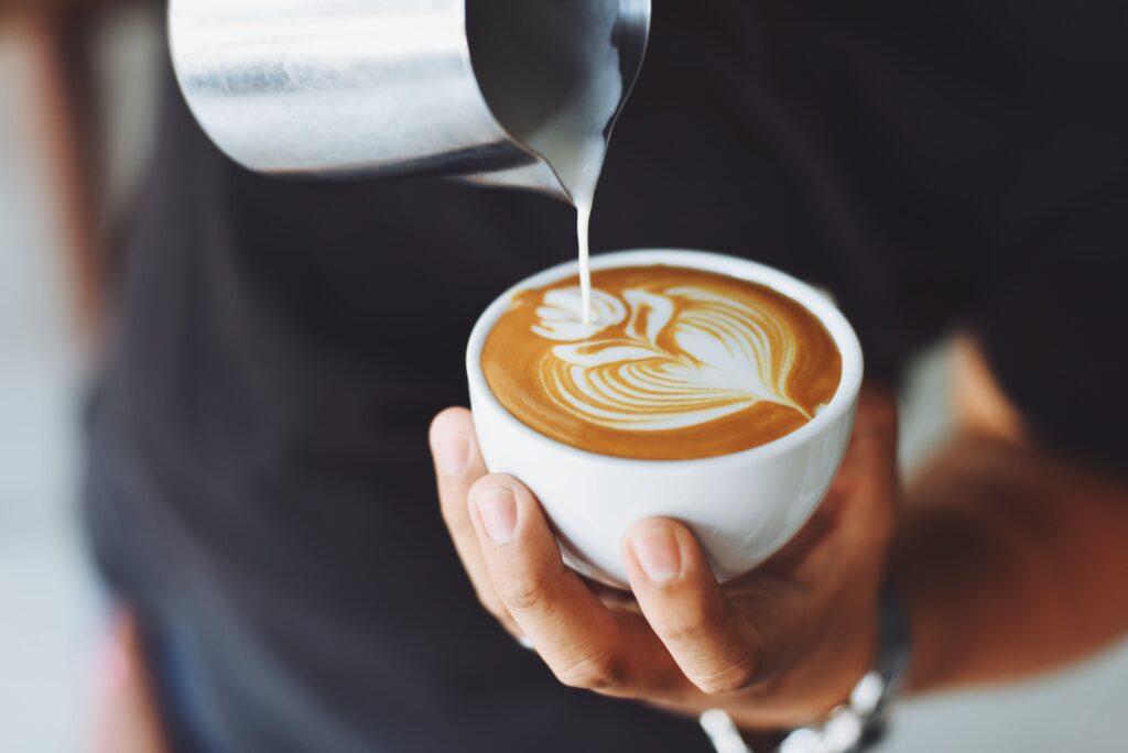 A photo of a latte being poured.